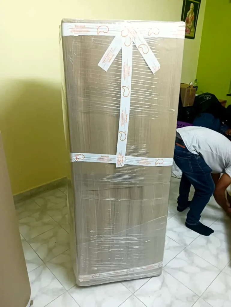 Refrigerator wrapped and taped for shifting