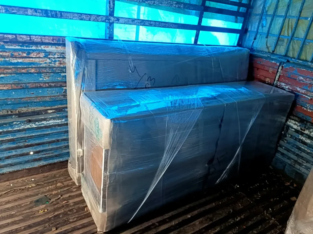 Wrapped furniture secured inside a truck