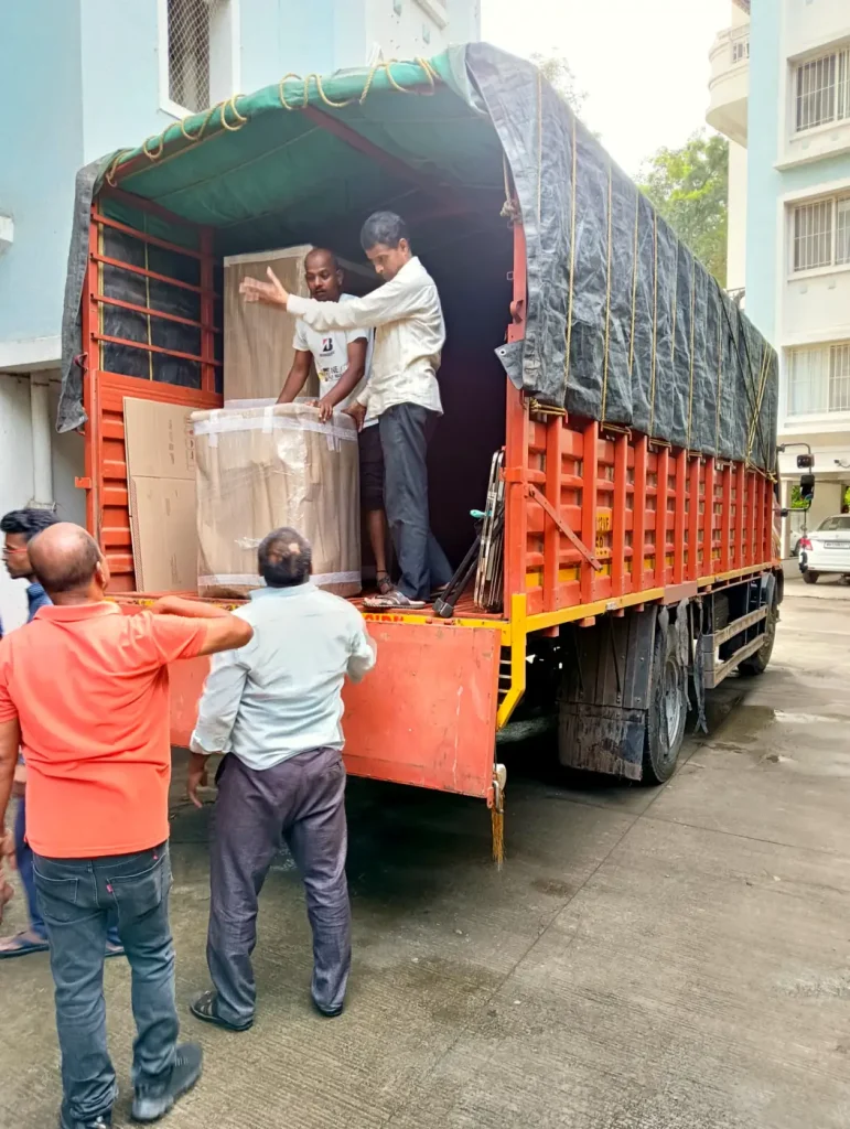 Crew loading a covered truck